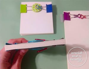 Paper cut, aligned & binder clipped